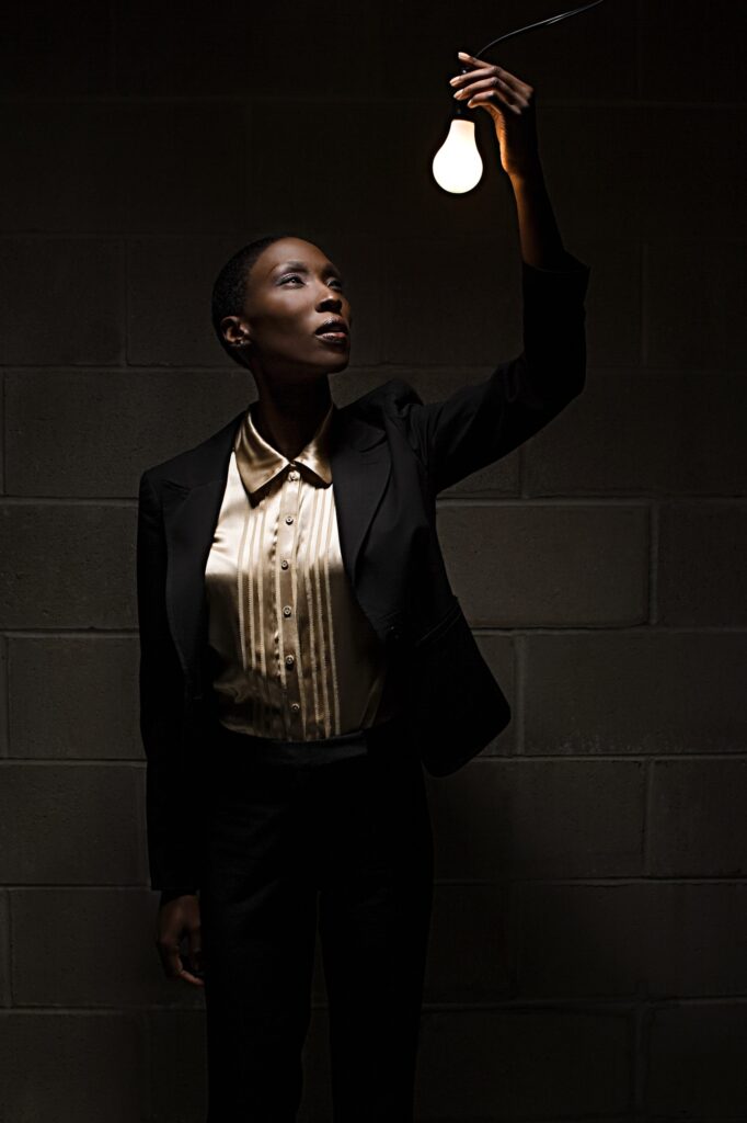 Businesswoman holding lightbulb